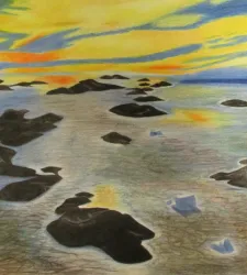 landscape of islands in water, with bright yellow and orange streaks in the sky